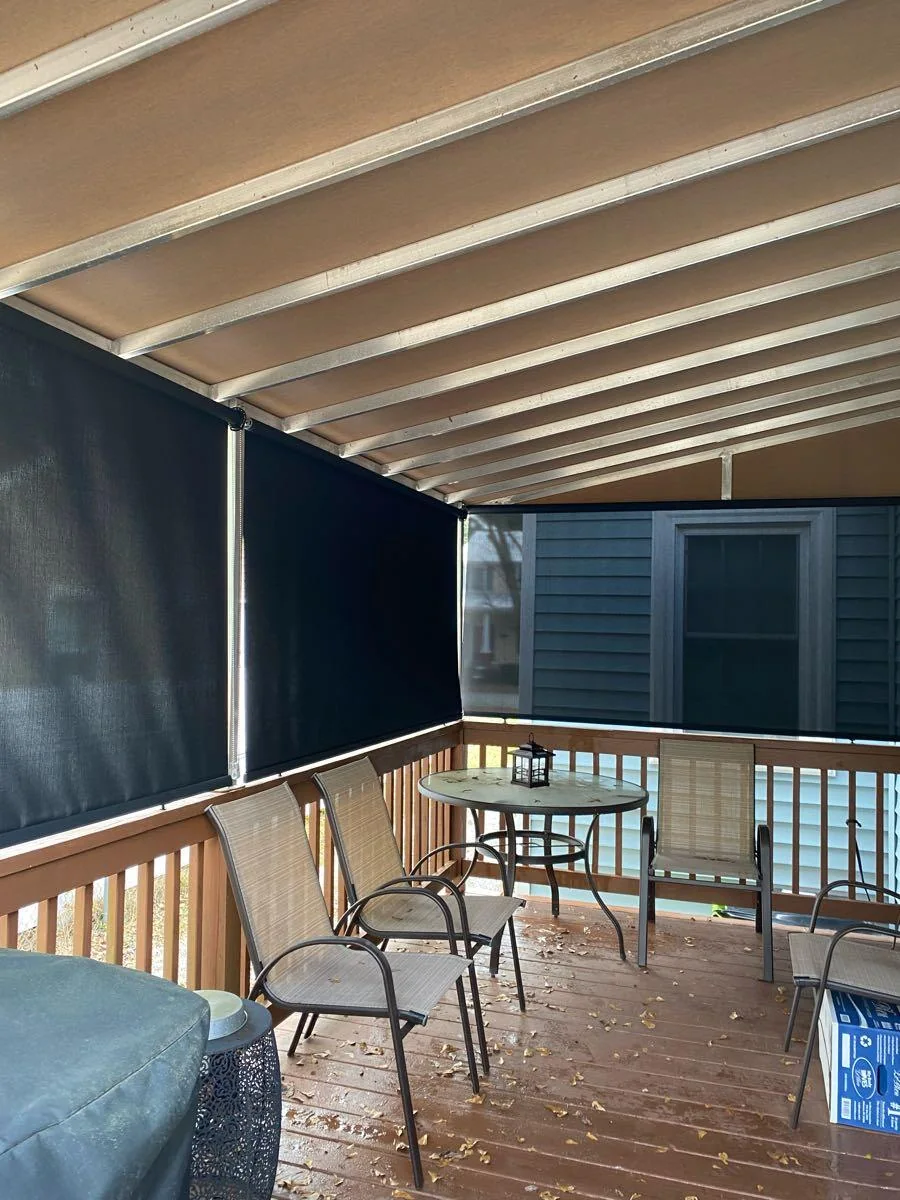 Another view of a covered porch with shades
