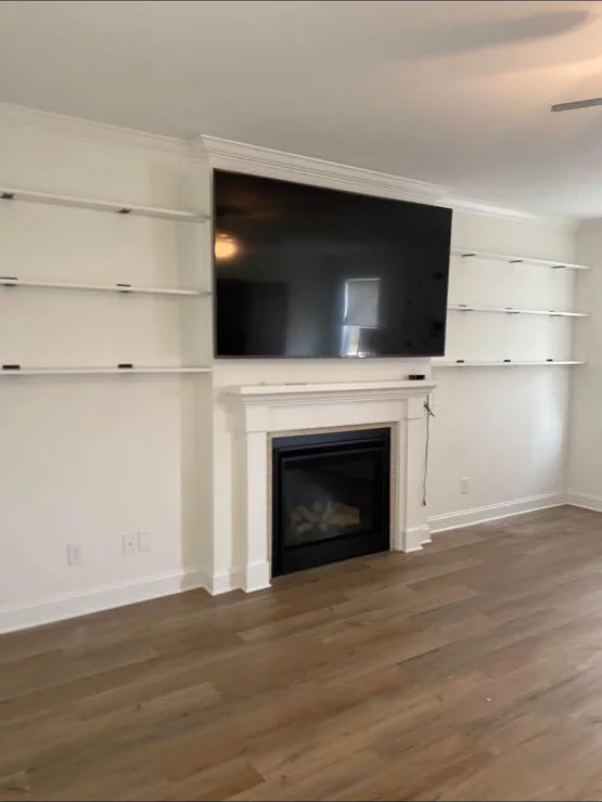 Television above a fireplace