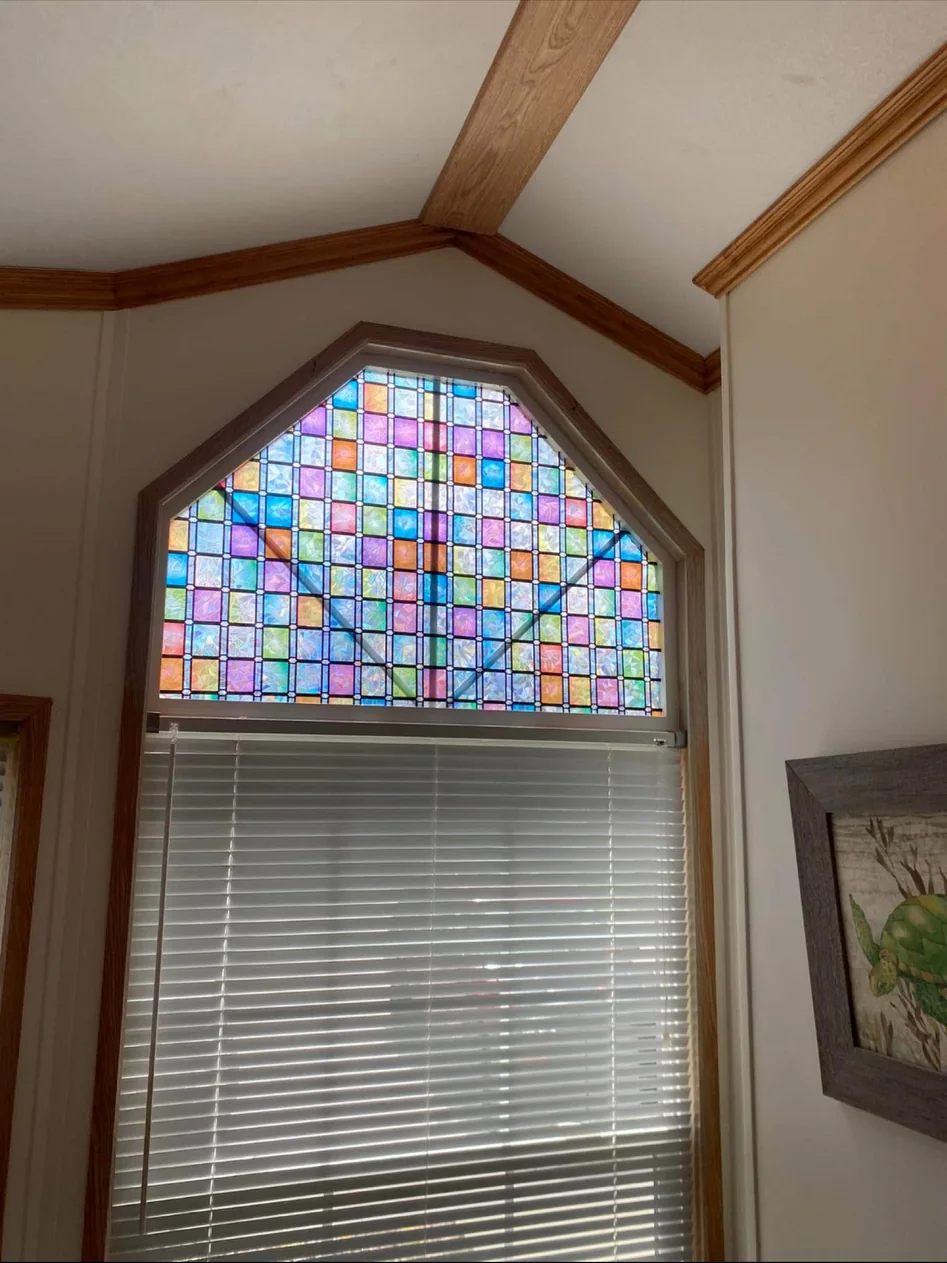 Decorative upper window film above white blinds