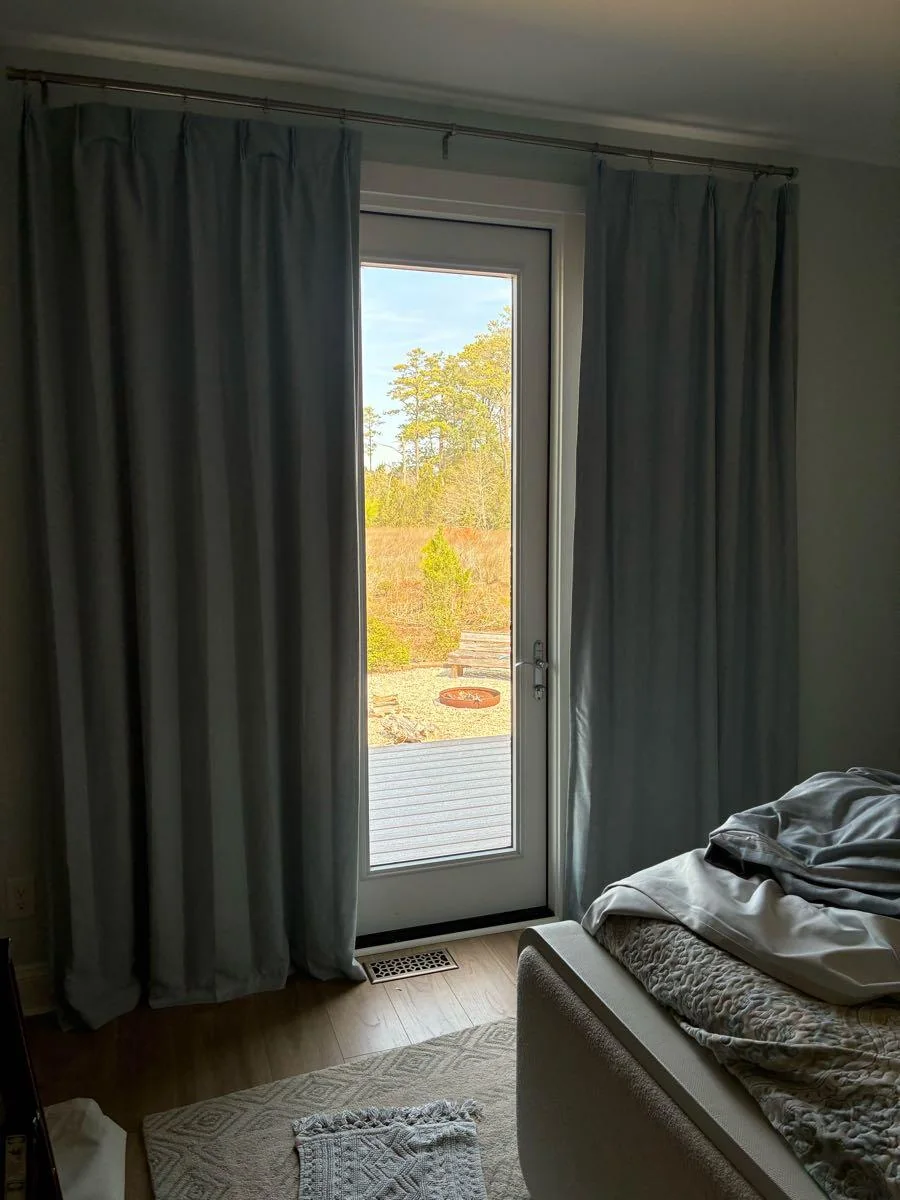 Curtains framing a glazed door